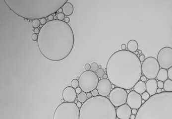 Abstract oil droplet on water surface to create shape and pattern background.