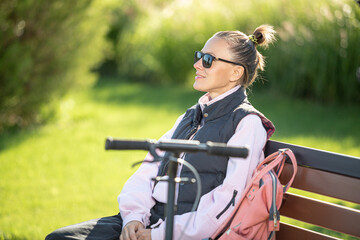 Woman relaxing relieving stress on a bench