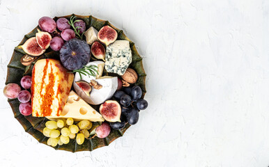 French cheese collection camembert, emmental, marble delicous cheese, blue cheese french, dorblu, mold, roquefort, cheese platter, snacks. place for text, top view