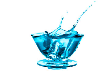 Water splash in glass with navy blue background.