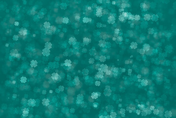 Abstract bokeh background in green colour of four leaf clover pattern. Defocus Concept.