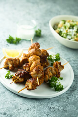 Healthy chicken skewers with lemon