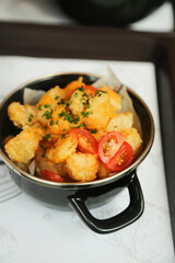 Popcorn shrimp with tomatoes and chives
