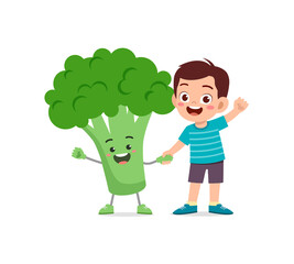 cute little boy stands with broccoli character