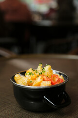 Popcorn shrimp with tomatoes and chives