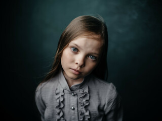 girl in gray shirt posing close-up studio emotions