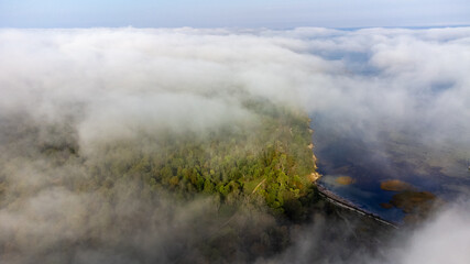 Aerial View from of the fog forest and the sea