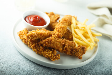 Fast food chicken strips with French fries