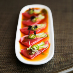 Raw tuna appetizer with spicy sauce