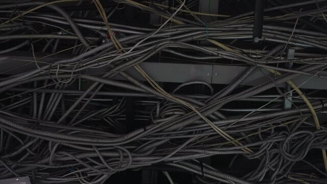 tangle of electric cable on ceiling