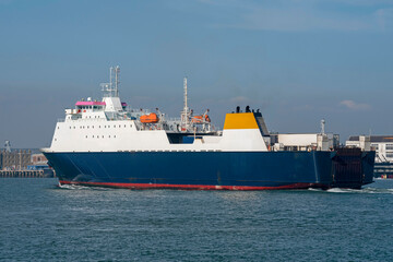 Naklejka premium Portsmouth, England, UK. 2021. RORO freight ferry with cargo of trucks underway.