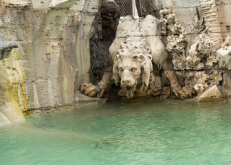 Fototapeta na wymiar A statue of the Fontana dei Quattro Fiumi (Fountain of the Four Rivers), in the Piazza Navona, Rome, Italy 