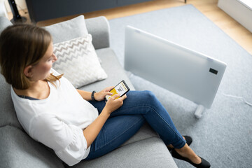 Happy Warm Woman Near Radiator