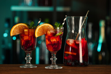 Delicious sangria cocktail on wooden table in bar