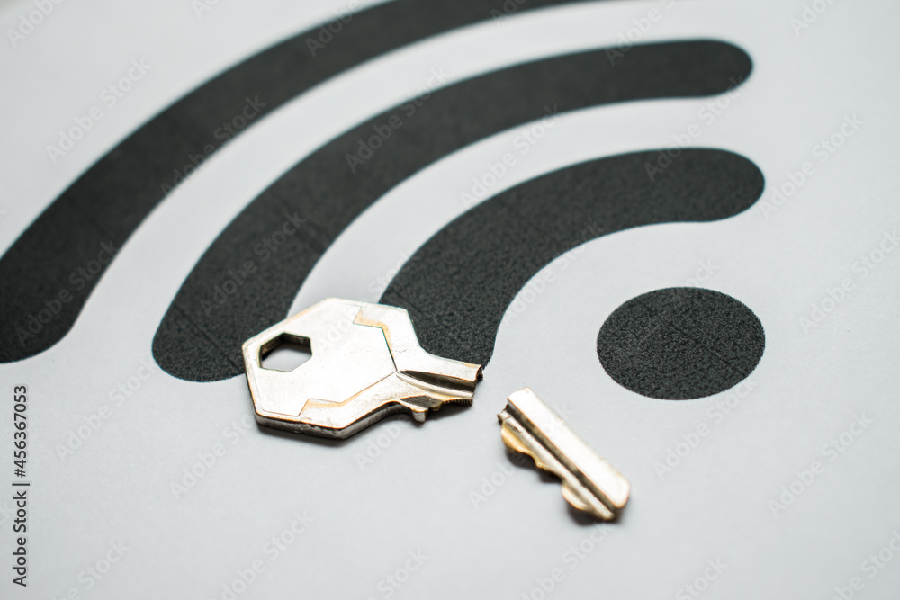 Poster closeup of a broken key on a white background with the wifi signal