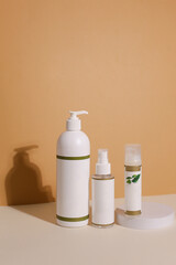 Eco friendly Bottle or jar with natural skincare cosmetics, creams or oils on light background. Plant-based beauty products