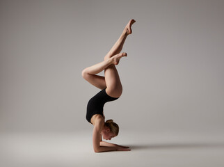 Beautifull flexible blonde girl posing. Gymnastics.	