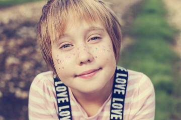Funny outdoor portrait of 10 years old girl