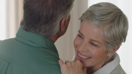happy mature couple dancing at home enjoying romantic dance together celebrating relationship milestone having peaceful retirement 4k