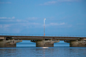Long nautical pier seascape during a serene summer dusk along a canadian waterfront
