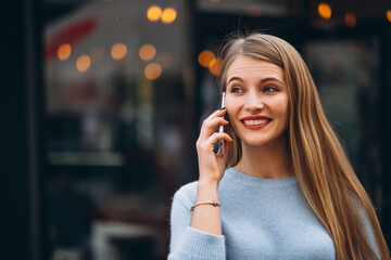 Young woman using phone