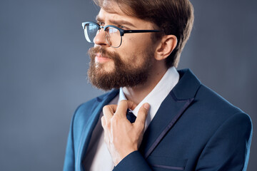 The man in a suit with glasses success Job dark background