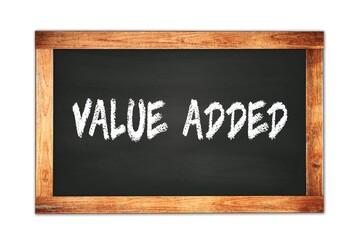 Obraz premium VALUE ADDED text written on wooden frame school blackboard.