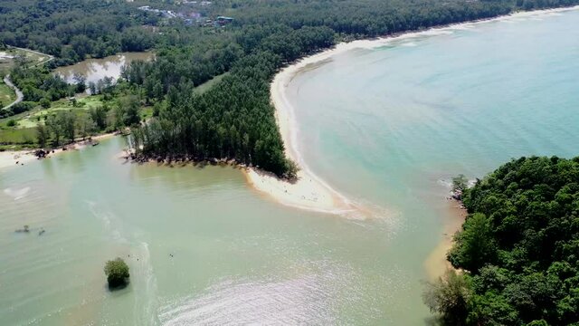 Aerial drone view of small island near tropical Layan Beach area in Phuket, Thailand