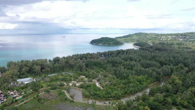 Aerial drone view of small island near tropical Layan Beach area in Phuket, Thailand