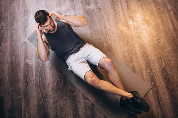 Fitness man doing abdominal exercises
