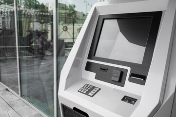 Close-up of a ticket vending machine with a blank black screen