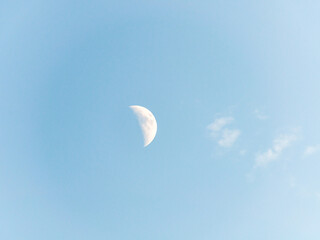 London, United Kingdom, 15 August,  2021: The Moon in daytime in a blue sky has something beautiful.
