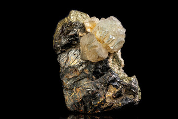 Macro of a mineral stone Sphalerite with fluorite and pyrite on a black background close up