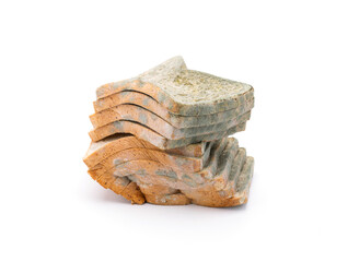 Mouldy bread isolated on white background.