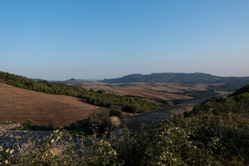 Naklejka premium The landscapes of Tuscany with their typical architecture, agricultural use and widespread hills.