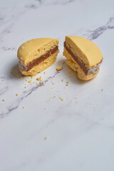 Traditional Argentinian alfajores with dulce de leche on marble table. Argentine gastronomy concept.