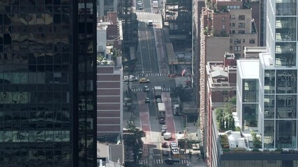 Manhattan, New York City, New York United States - August 29 2021: Faltiron Building under renovation surrounded by people, traffic and cafes. View from above. Video sped up by a factor of 8 times.