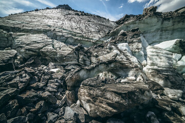 Scenic mountain landscape with big glacier and high top in sunny day. Awesome highland scenery with...