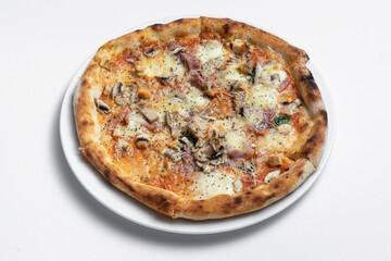 closeup of italian pizza with ham, mushrooms and cheese on white background