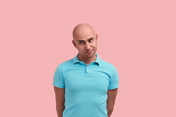 Shy bald homosexual man with bristle is apologising, begs pardon, admits guilt, purses lip and...