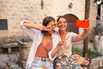 Two young women make selfie