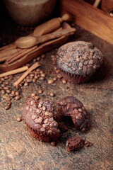 Chocolate muffins on a brown background.