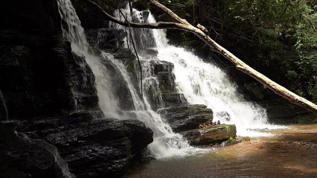 A beautiful large waterfall in a tropical evergreen forest. rich forest northern thailand