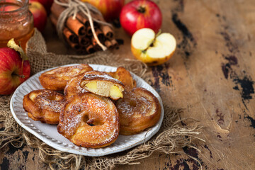 Sweet pancakes with apples, cinnamon and powdered sugar