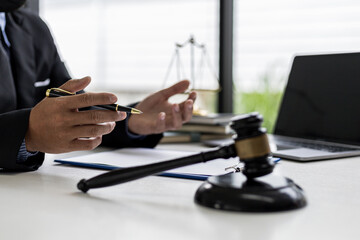 A lawyer explaining the details of the case and the law to his client as a way to fight the...