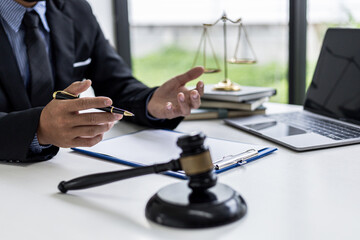 A lawyer explaining the details of the case and the law to his client as a way to fight the lawsuit, the client consulted a fraud attorney. Concept of litigation consultation from legal experts.