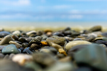 Sea waves blue sky sea pebbles.