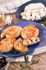 Pastry swirls with cheese and olive filling.