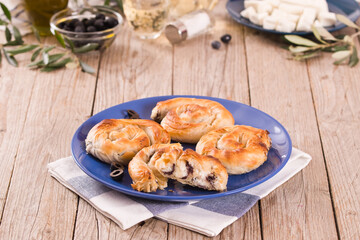 Pastry swirls with cheese and olive filling.