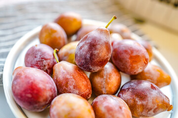 Indoor studio fresh prunes close-up